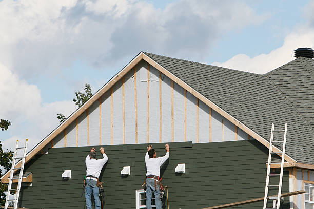 Professional Siding technician working in Natick, MA